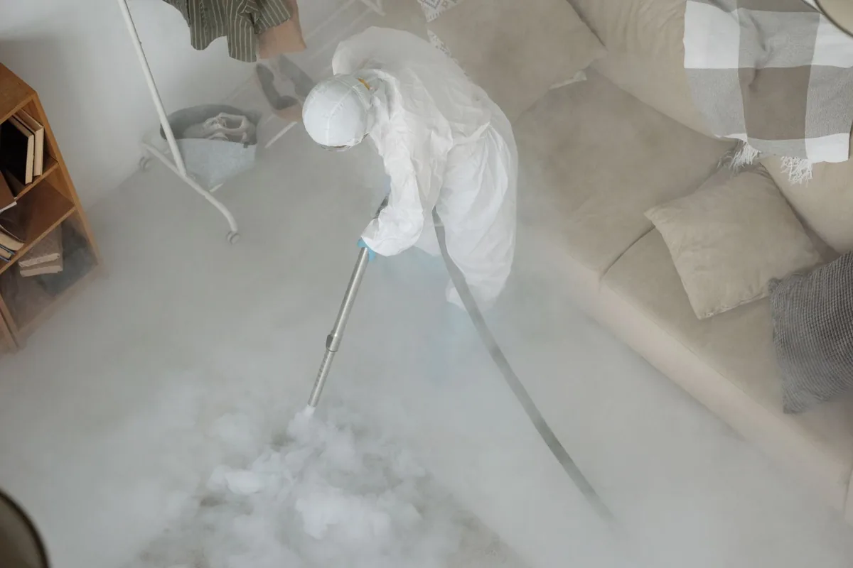 Biohazard cleanup technician in protective equipment, Winterville, GA